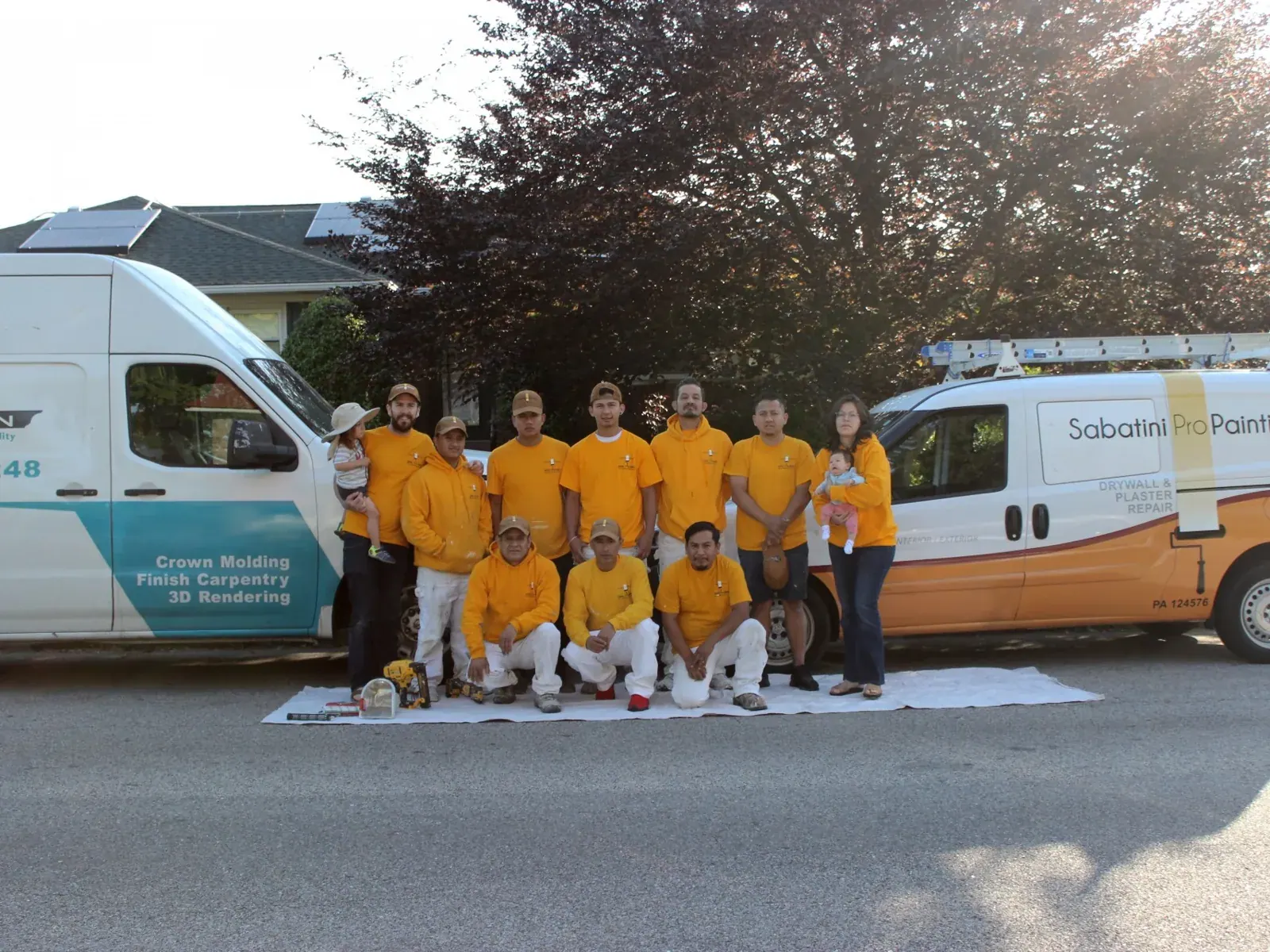 The Sabatini Pro Painting team in front of the company vans
